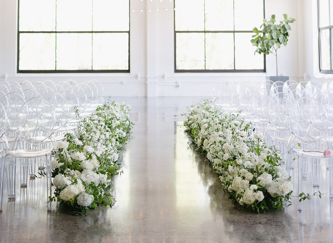 Elegant banquet hall with white flowers — Urban Daisy