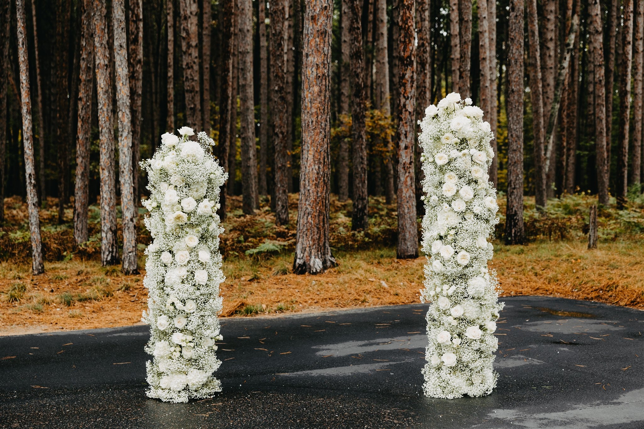 White floral columns forest wedding ceremony — Catalyst by Nature Link