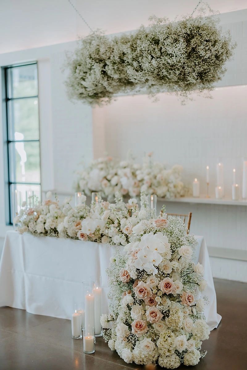 Wedding venue with hanging floral installation in blush and white